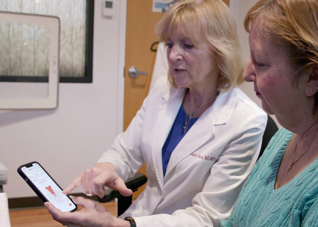 Happy Patient With Staff Member