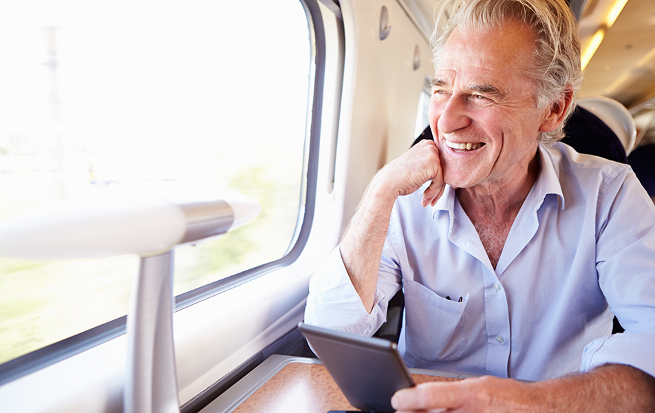 Happy man traveling on a train