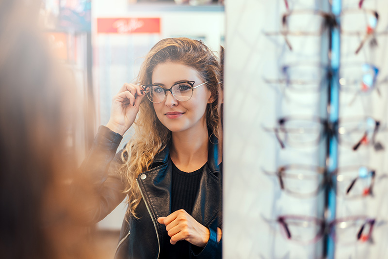 Woman trying on glasses